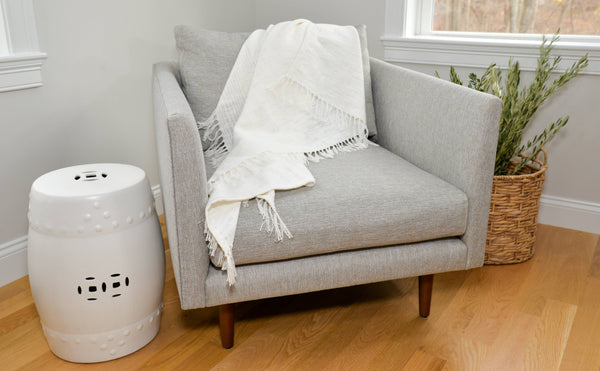 Simple timeless comfortable hand woven ivory cotton throw.